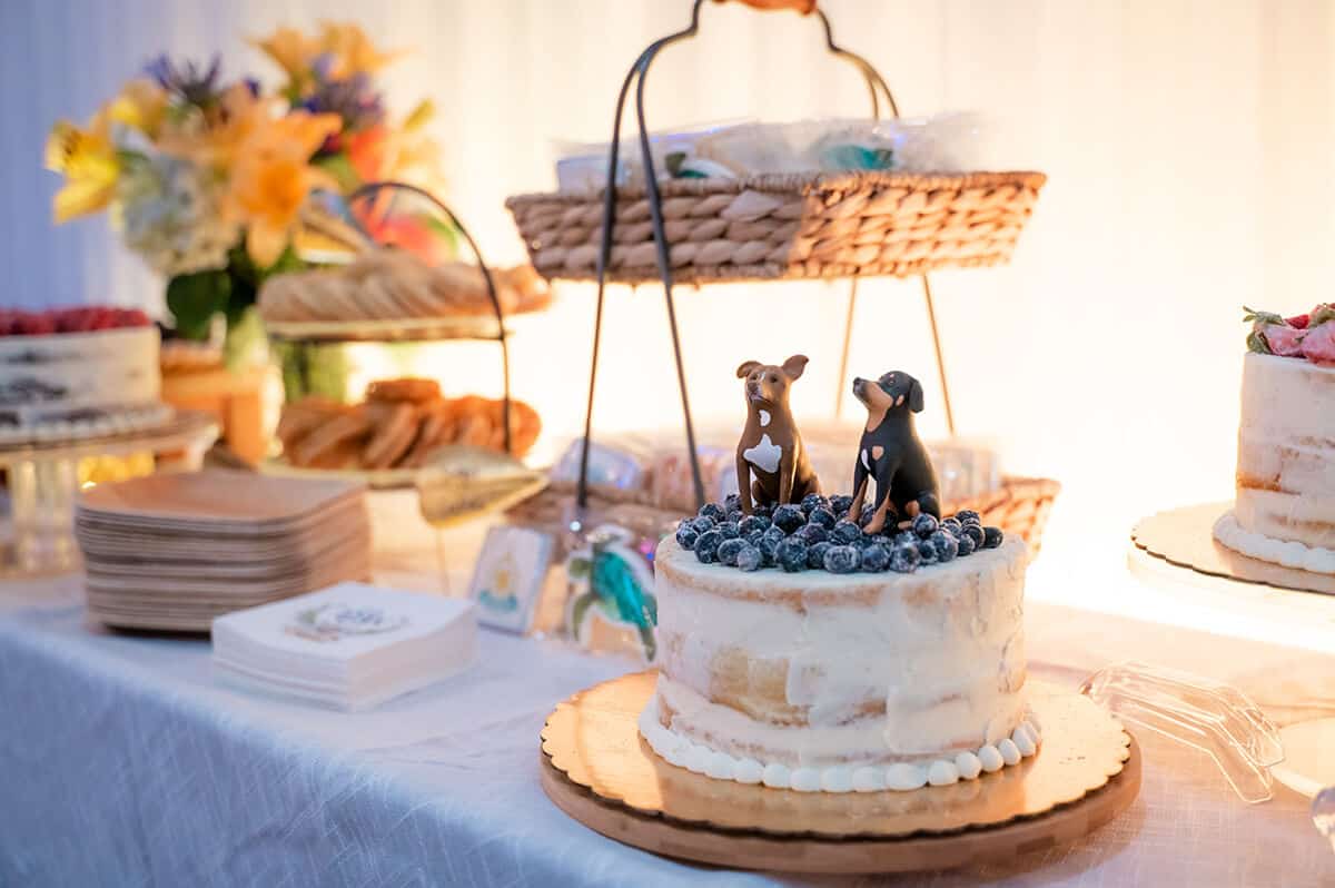 custom wedding cake with dogs as topper
