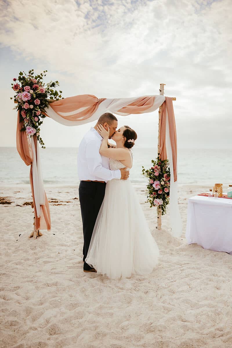 Romantic Tampa Bay elopement on the beach at sunset.