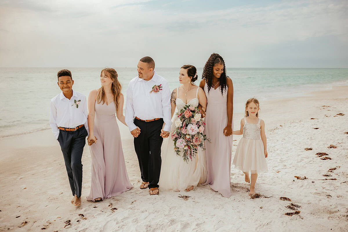 Bride and groom exchanged vows at a scenic beach with their families in Tampa Bay.